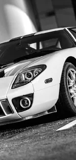 Black and white vintage sports car parked.