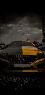 Black and yellow Mercedes car in cloudy backdrop.