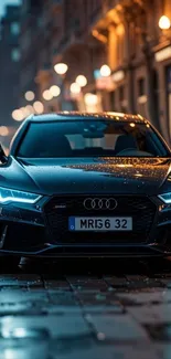 Sleek black Audi car on a rainy city street at night.