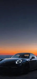 Sleek black car against a sunset backdrop on the road.