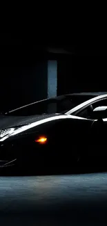 Sleek black sports car parked in a dimly lit garage with moody lighting.