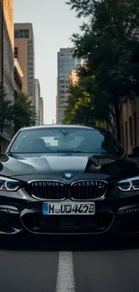 Sleek black car in city street setting.