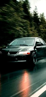 Black car driving fast on a rainy forest road.