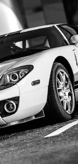 Sleek black and white sports car wallpaper for mobile phone.