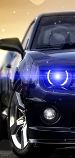 Sleek black car with blue headlights and blurred background.