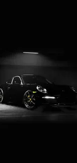 Sleek black sports car in dark setting wallpaper.