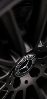 Black luxury car wheel closeup with sleek design.