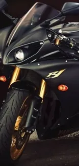 Sleek black motorbike with gold accents.