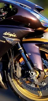 Black sports motorcycle with gold accents on a dynamic mobile wallpaper.