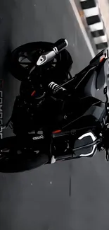 Sleek black motorcycle on urban road.