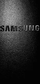 Minimalist black Samsung wallpaper with textured design.