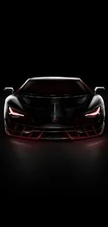 Futuristic black sports car with glowing red accents on a dark background.