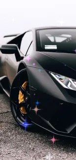 Black sports car parked on asphalt with sleek, modern design.