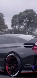 Sleek black sports car with red lights and dark sky.