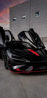 Sleek black sports car with red accents and open doors.