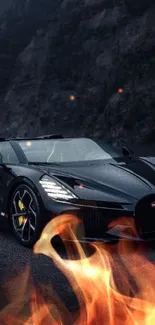 Sleek black sports car on a winding mountain road.