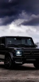 Black SUV on an overcast evening background.