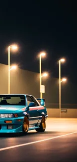 Blue car illuminated under streetlights at night, on an empty road.