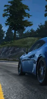 Blue sports car on a curvy mountain road.