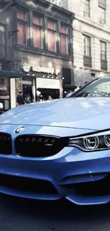 Sleek blue car parked on a busy city street.