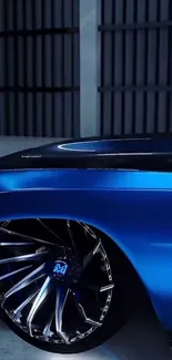 Sleek blue sports car with shiny wheel