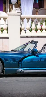 Sleek blue convertible car parked elegantly.