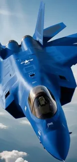 Blue fighter jet soaring through the sky.