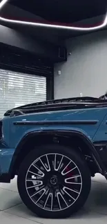 Sleek blue luxury car in modern showroom.
