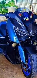 Three sleek blue motorcycles in a vibrant garage setting.