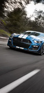 Blue sports car speeding on a road in dynamic motion.