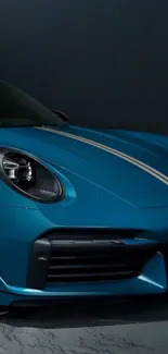 Sleek blue sports car in dim lighting for wallpaper.