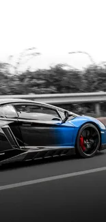 Dynamic blue sports car driving on road with blurred background.