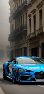 A sleek blue sportscar on a misty urban street.