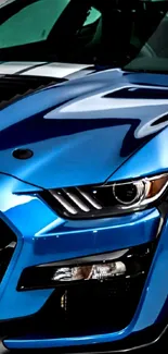 Close-up of a sleek blue sports car in motion.