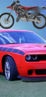 Red sports car and dirt bike under blue sky wallpaper.