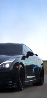 Sleek black car against a blue dusk sky in an urban setting.