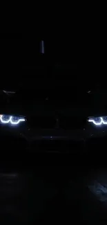 Car headlights piercing through darkness.
