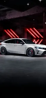 Sleek sports car illuminated by neon lights in an industrial garage setting.