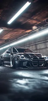Sleek luxury car in dark urban tunnel.