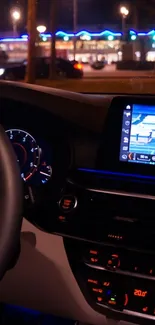 Car interior with illuminated dashboard and navigation screen at night.