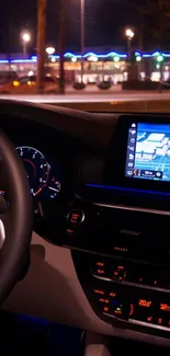 Sleek car interior with illuminated dashboard and navigation screen.
