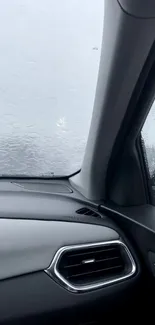 Interior view of a car with rainy windows creating a modern aesthetic.