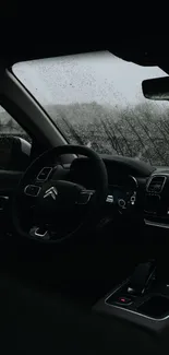 Sleek car interior with rain on the windshield background.