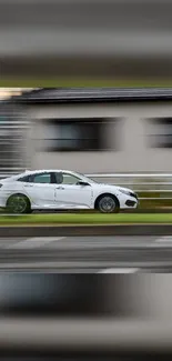 White car in motion with urban blurred background.