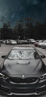 Luxury car under a starry night sky in a parking lot.