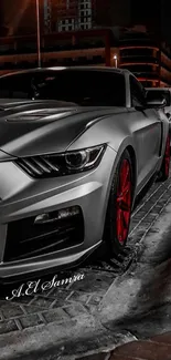 Sleek modern car parked under city night lights with red detailing.