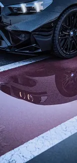 Luxury car reflecting on wet pavement.