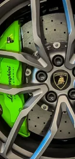 Close-up of a Lamborghini wheel with vibrant green brake caliper.