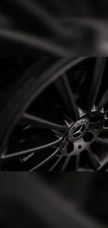 Close-up of a sleek metallic car wheel, perfect for automotive wallpaper.