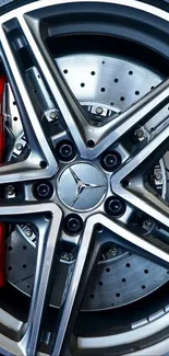 High-definition image of a sleek alloy car wheel with a red brake caliper.